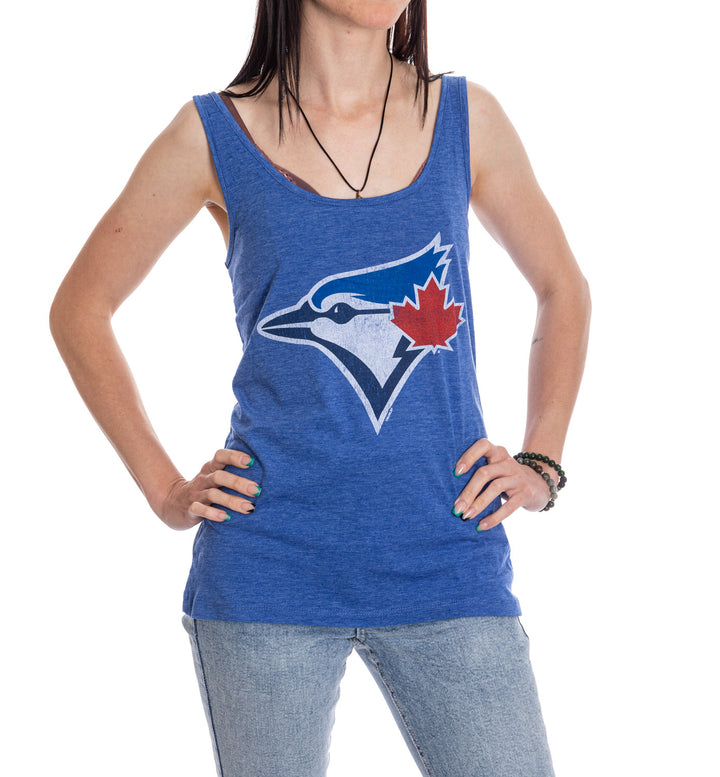 Cheer on the Blue Jays this summer while looking stylish in this lightweight flowy tank top! The Criss Cross strap detail will add style to your gameday look.  Made from polyester/cotton blend fabric, this lightweight tank is super comfortable and will let you show your true Blue Jays Fandom! 
