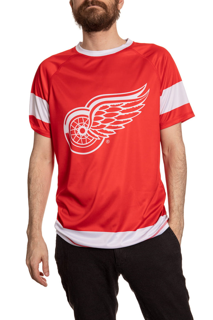 Detroit Red Wings Short Sleeve Game Day Rashguard Front View. Red Short Sleeve Shirt With White Accent.