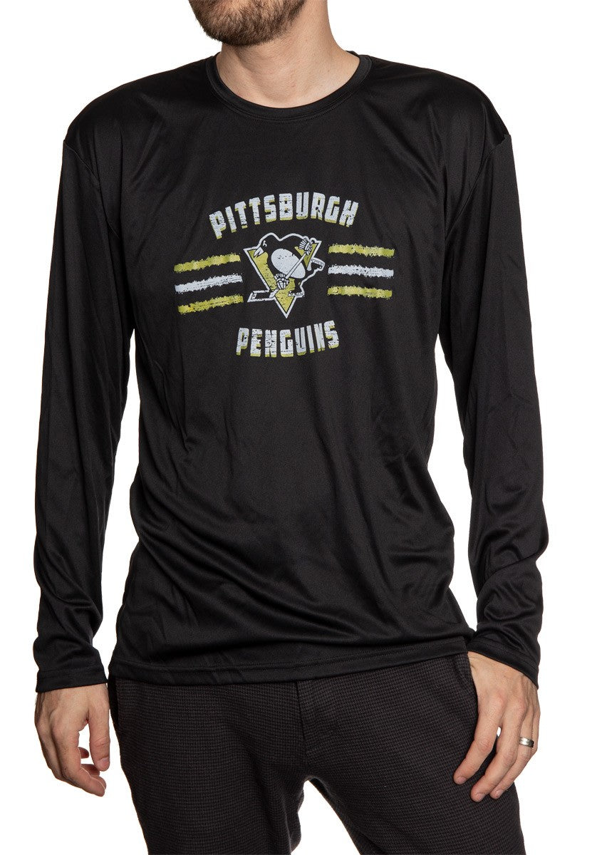 Men's Officially Licensed NHL Distressed Lines Long Sleeve Performance Rashguard Wicking Shirt- Pittsburgh Penguins Full Front View Of Man Wearing Shirt