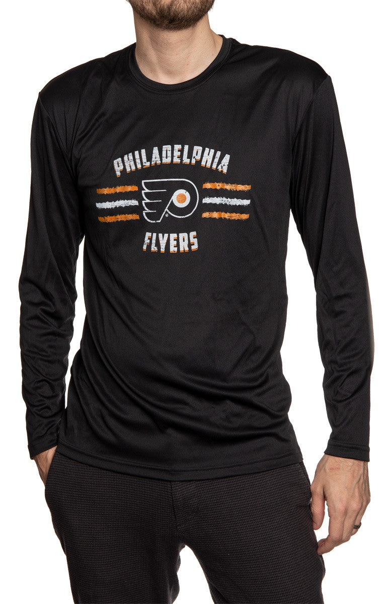 Men's Officially Licensed NHL Distressed Lines Long Sleeve Performance Rashguard Wicking Shirt- Philadelphia Flyers Man Wearing Long Sleeve Shirt With Hand In Pocket 