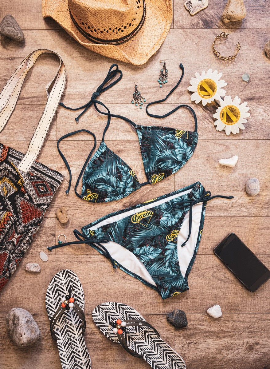 Ladies Corona Bikini- Dark Palm Print Lifestyle Photo with Tote Bag, Sandals and Sunglasses