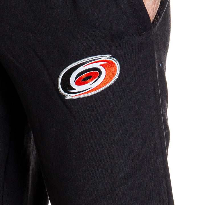 Carolina Hurricanes Premium Fleece Sweatpants Close Up of Embroidered Logo. 