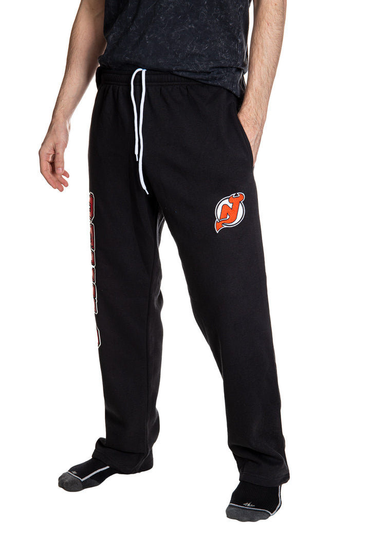 New Jersey Devils Premium Fleece Sweatpants  Side View of Embroidered Logo.