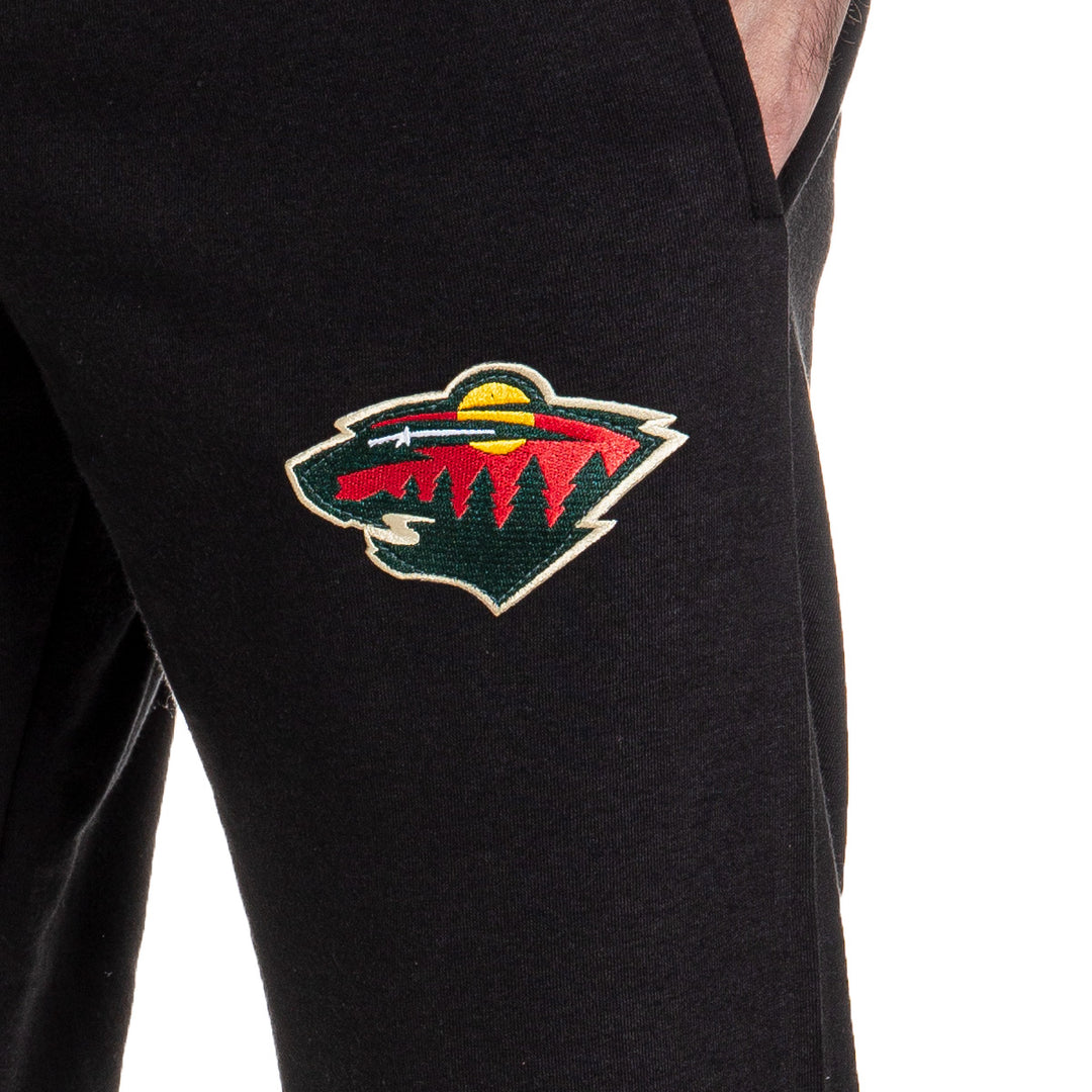 Minnesota Wild Premium Fleece Sweatpants Close Up of Embroidered Logo.