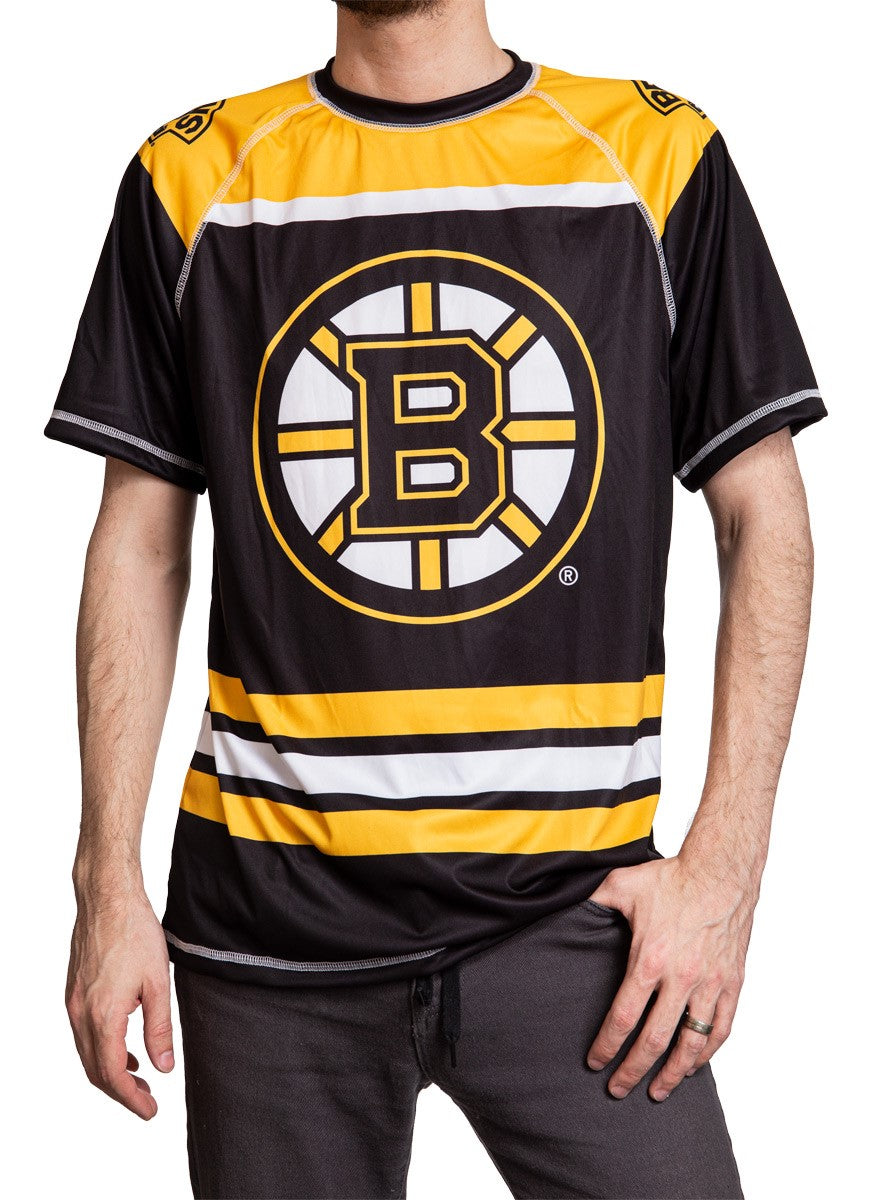 Boston Bruins Short Sleeve Game Day Jersey Front View. Black And Yellow Design With Bruins Logo In MIddle of Chest.