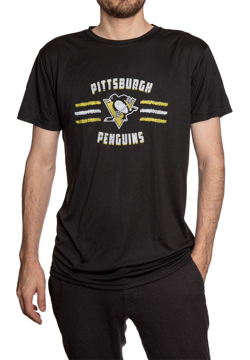 Men's Officially Licensed NHL Distressed Lines Short Sleeve Performance Rashguard Wicking T-Shirt- Pittsburgh Penguins  Full Length Photo of Man Wearing Shirt With Hand In Pocket